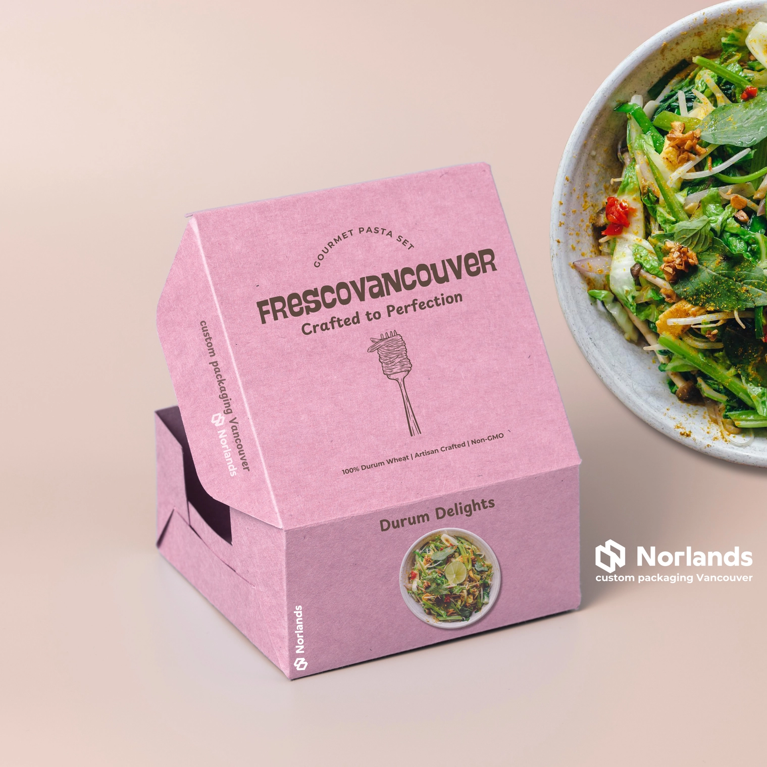 Packaging Vancouver:The image showcases a custom packaging design for a gourmet pasta brand named "Frescovancouver." The box is pink with the tagline "Crafted to Perfection" and highlights product details such as "100% Durum Wheat," "Artisan Crafted," and "Non-GMO." A bowl of fresh pasta is shown beside the packaging, emphasizing the product's quality and appeal. The packaging also features branding for "Norlands Custom Packaging Vancouver," reflecting its custom design expertise. The text highlights both the premium nature of the product and its connection to Vancouver's packaging services.