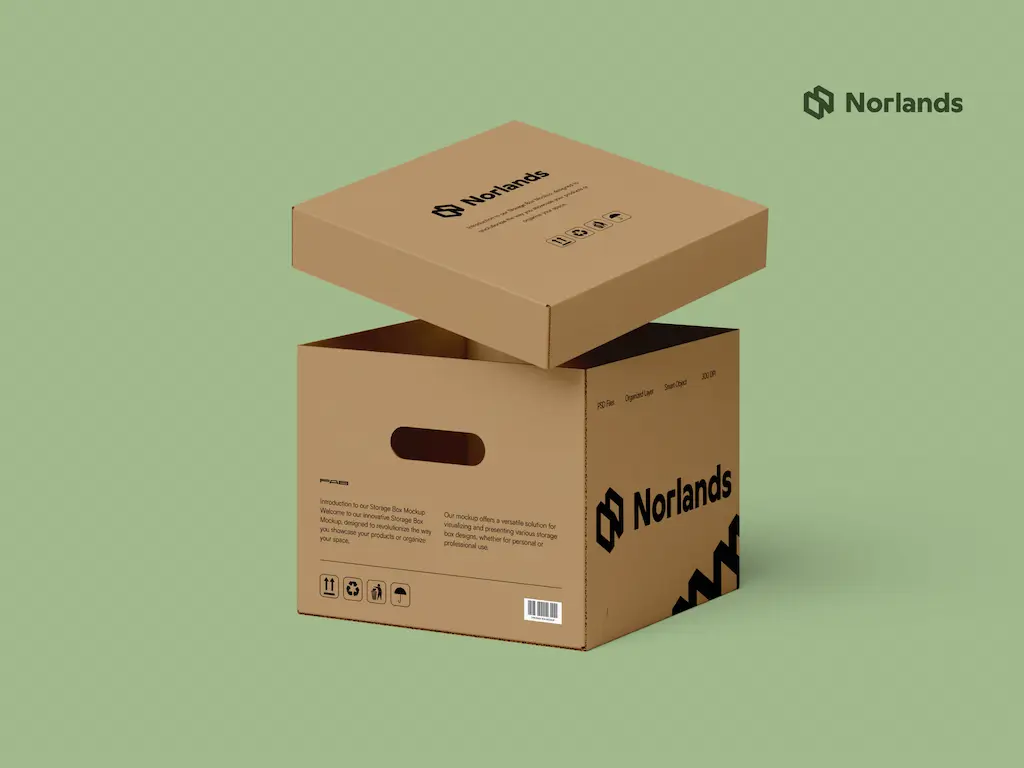 An eco-friendly Norlands cardboard storage box with a removable lid, displayed against a light green background. The box features cutout handles, printed icons, and the Norlands logo in bold black.