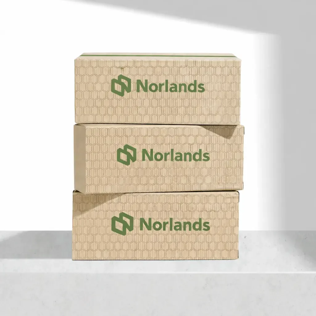 Stacked kraft corrugated boxes showcasing sustainable packaging material decisions BC for strength, recyclability, and performance consistency