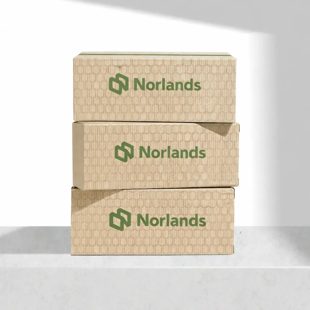 Stacked kraft corrugated boxes showcasing sustainable packaging material decisions BC for strength, recyclability, and performance consistency