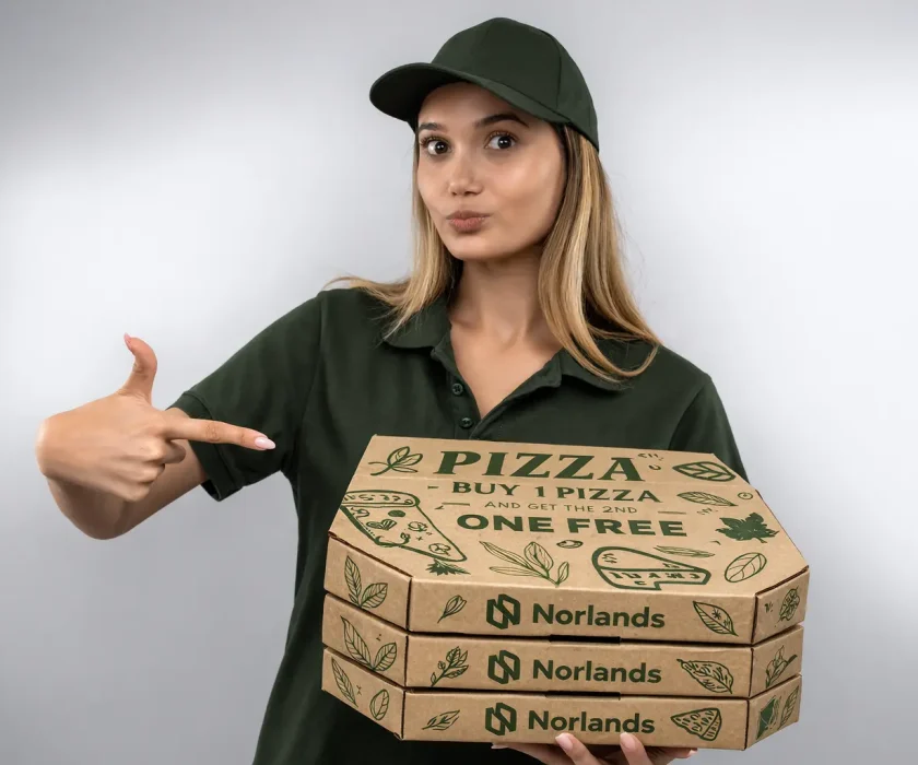 Food delivery worker holding stacked pizza boxes demonstrating how packaging delays Western Canada can impact restaurant delivery operations
