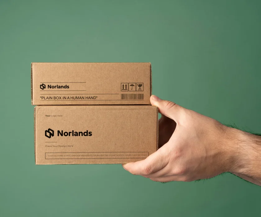 Hand holding small custom packaging boxes Vancouver designed for retail products and branded shipping