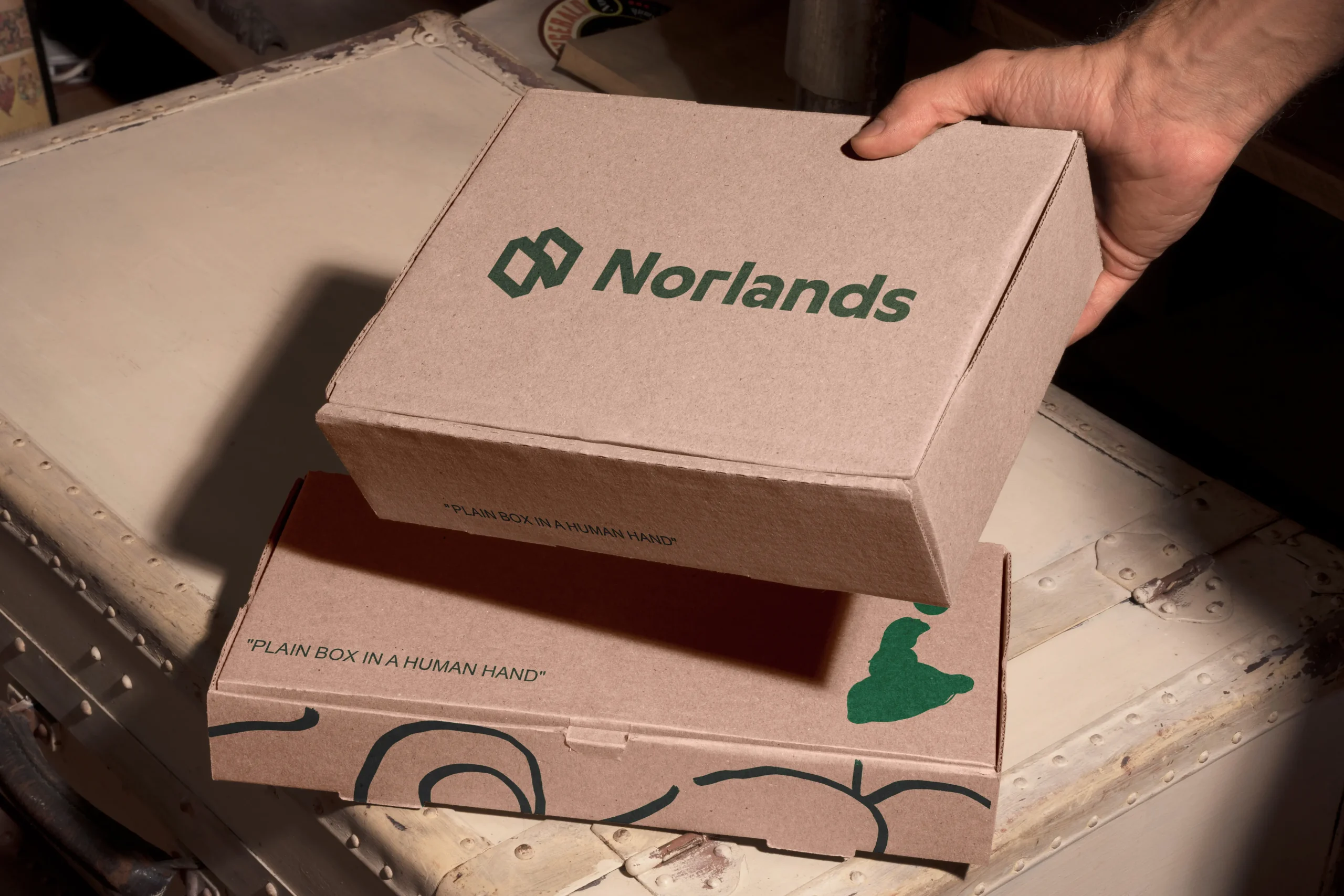 Hand placing corrugated food packaging boxes Vancouver used for pizza and takeaway food packaging